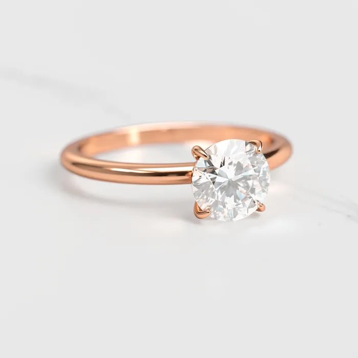 Rings Capucinne Round Tapered Solitaire Diamond Ring