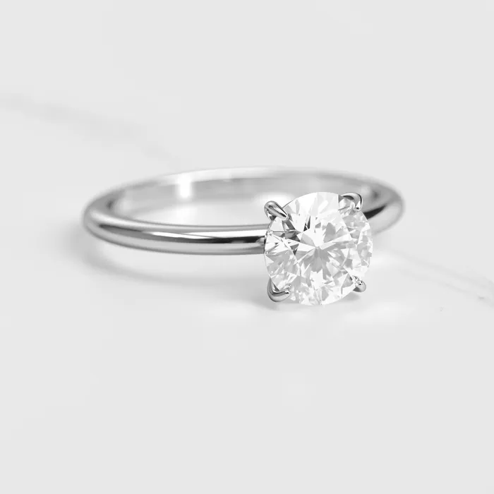 Rings Capucinne Round Tapered Solitaire Diamond Ring