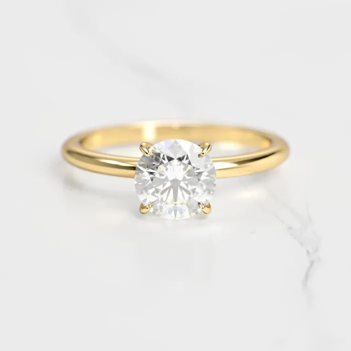 Rings Capucinne Round Tapered Solitaire Diamond Ring