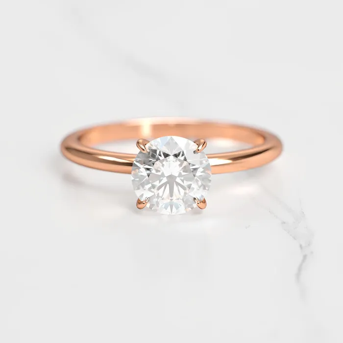 Rings Capucinne Round Tapered Solitaire Diamond Ring