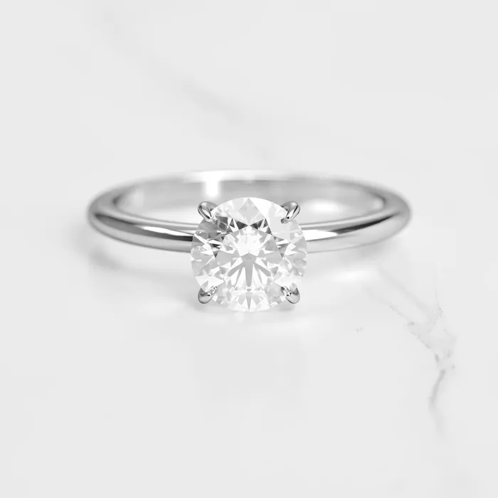 Rings Capucinne Round Tapered Solitaire Diamond Ring